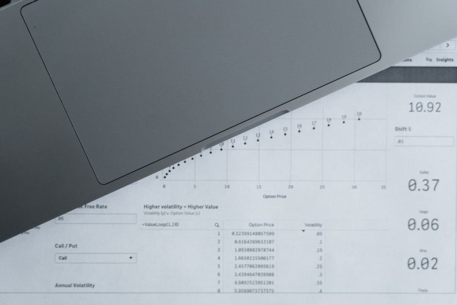Google Sheets vs Airtable vs Excel comparison, person analyzing data tables on a laptop screen