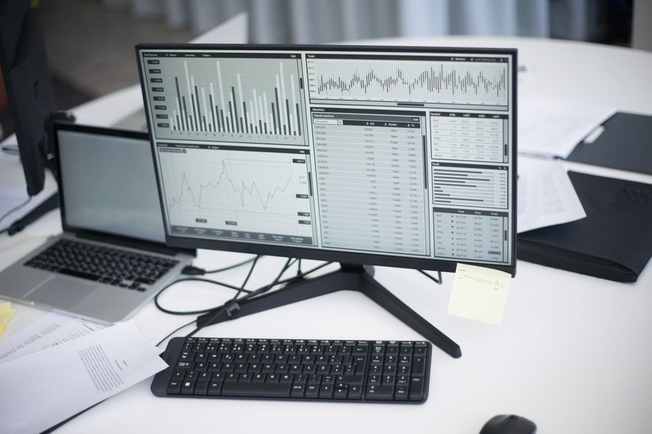 Monitor showing analytical graphs, representing Make.com operation usage tracking