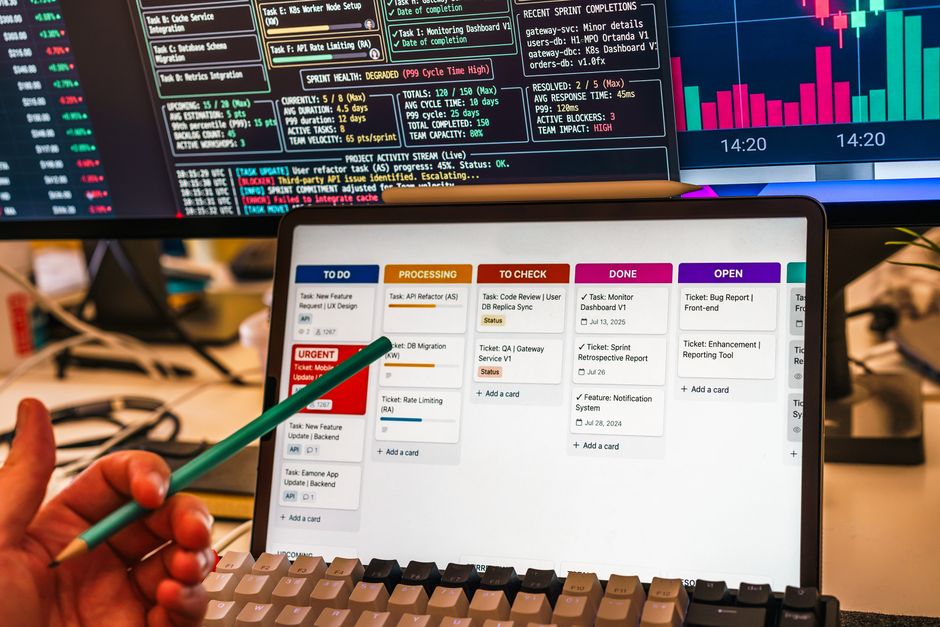 Make.com automation workflow on a tablet and multiple screens showing connected apps